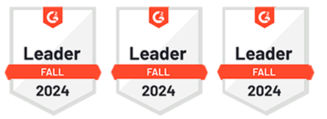 Three award badges, each shaped like a shield with the "G2" logo at the top, and a red banner across the middle stating "Leader Fall 2024".